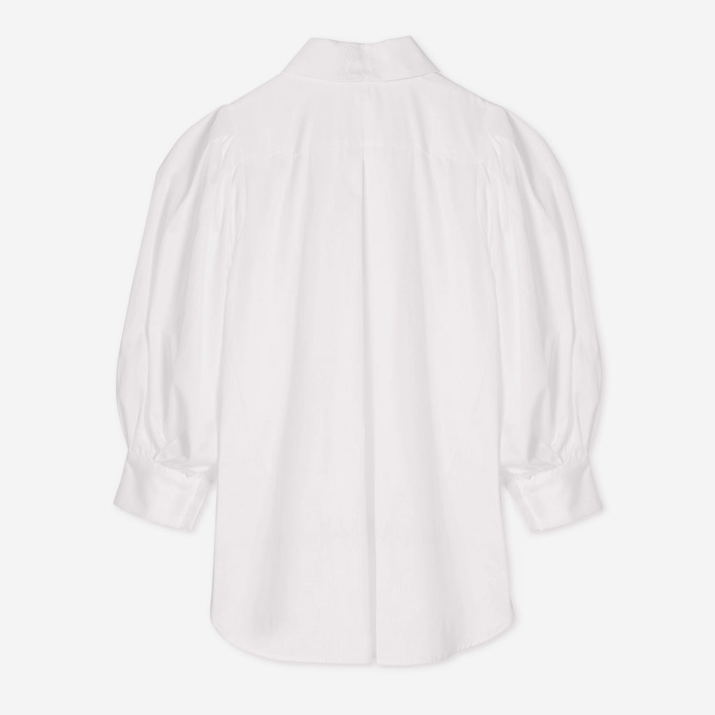 white blouse black buttons